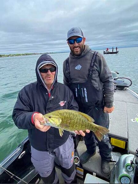 Tyler and client smallmouth bass img1020
