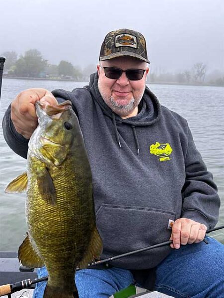 Angler with big smallmouth bass img6482
