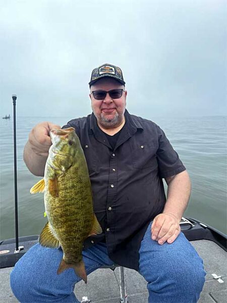 Man with big smallmouth bass img6479